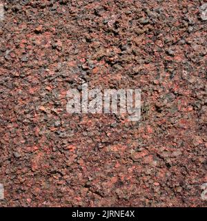 Pink rock texture, pink granite stone from Brittany close up. Cote d'Armor Stock Photo