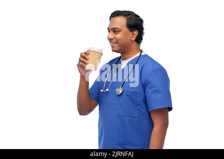 male doctor with stethoscope drinking coffee Stock Photo