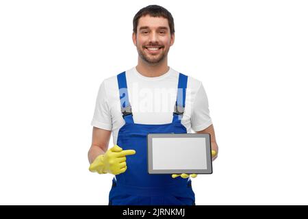 happy male worker or cleaner showing tablet pc Stock Photo