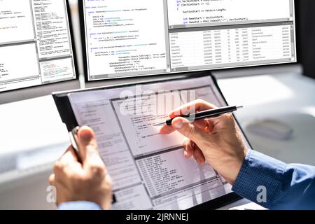 Web Developer Looking At Code. Computer Database Software Programming Stock Photo