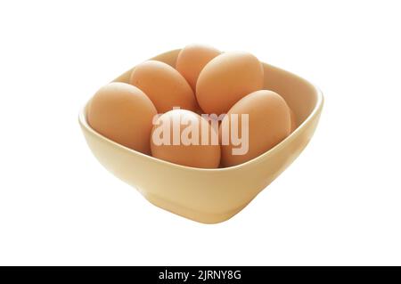 A bowl full of fresh hen eggs. Isolated on white background with clipping path, no shadow cut out Stock Photo