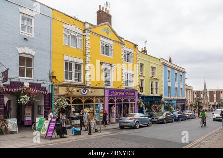 Shops in the High Street of Glastonbury town centre, Glastonbury, Somerset, England, UK Stock Photo