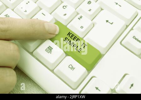 Hand writing sign Keep It Simple. Business concept Easy to toss around Understandable Generic terminology Woman Holding A Tablet And Pen Pressing On Stock Photo