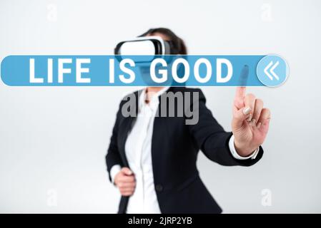 Sign displaying Life Is Good. Word Written on Obtain everything you want and more have health great job Woman Wearing Vr Glasses And Pointing On Stock Photo