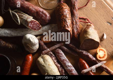 close up of typical spanish sausages on wooden table Stock Photo
