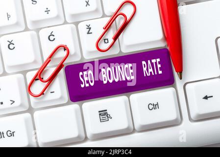 Sign displaying Seo Bounce Rate. Internet Concept Search engine optimization visitors navigate off the site Man Holding A Pen And Tablet Showing Stock Photo