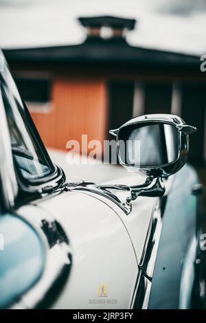 A vertical shot of vintage classic car details in the city of Hagfors, Sweden Stock Photo