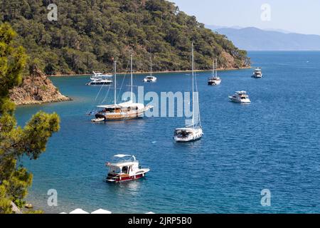 Gocek, Mugla, Turkey - July 17 2022: Yachts and boats anchored in Fethiye Gocek bays Stock Photo