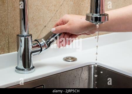 The concept of lack of tap water. The faucet has no running water Stock Photo