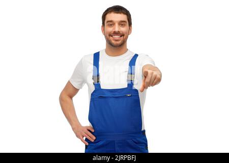 happy male worker or builder pointing to camera Stock Photo