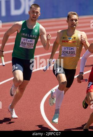 Jack Raftery and Marvin Schlegel competing in the mixed 4x100m relay heats at the World Athletics Championships, Hayward Field, Eugene, Oregon USA on Stock Photo