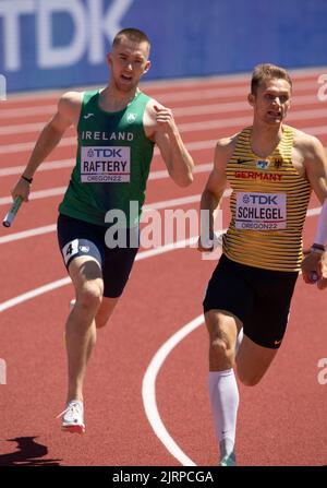 Jack Raftery and Marvin Schlegel competing in the mixed 4x100m relay heats at the World Athletics Championships, Hayward Field, Eugene, Oregon USA on Stock Photo