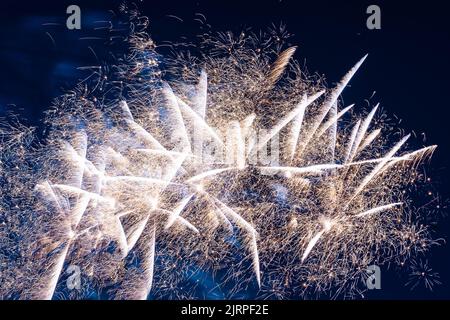 Bright light flash of fireworks, against the background of the night sky. High quality photo Stock Photo