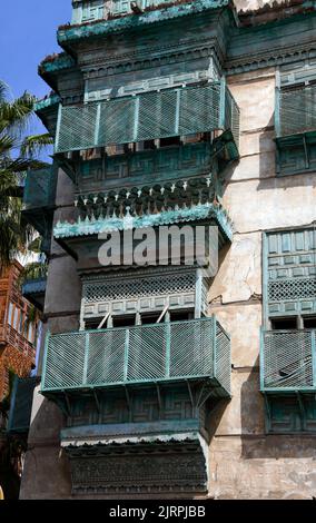 Typical restored green wooden balconies Al Balad Jeddah Saudia Arabia. Stock Photo