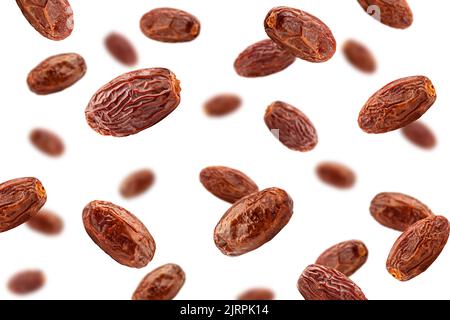 Falling Dates isolated on white background, selective focus Stock Photo