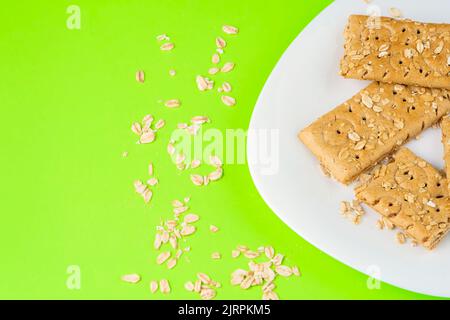 Oatmeal bar on a white plate, ready for breakfast copy space Stock Photo