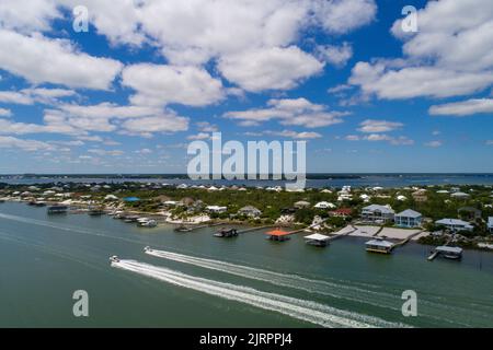 Boats alongside Ono Island in July Stock Photo