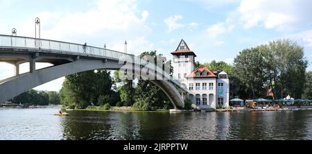 Berlin, Germany, July 29, 2022, curved abbey bridge over the Spree River at the Island of Youth Stock Photo