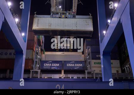 Odessa, Ukraine SIRCA 2019: Container ship at port terminal. Containers loading by crane in night , Trade Port. container operation in port series Stock Photo