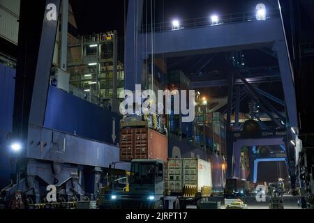 Odessa, Ukraine SIRCA 2019: Container ship at port terminal. Containers loading by crane in night , Trade Port. container operation in port series Stock Photo