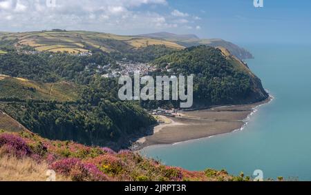 The view from the top of Countisbury Hill on the northern edge of Exmoor, looking towards Lynton and Lynmouth in North Devon, England. The village of Stock Photo