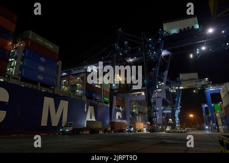 Odessa, Ukraine SIRCA 2019: Container ship at port terminal. Containers loading by crane in night , Trade Port. container operation in port series Stock Photo