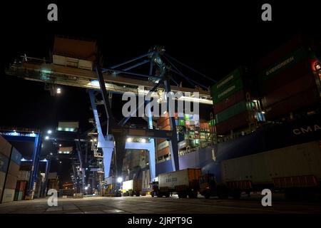 Odessa, Ukraine SIRCA 2019: Container ship at port terminal. Containers loading by crane in night , Trade Port. container operation in port series Stock Photo