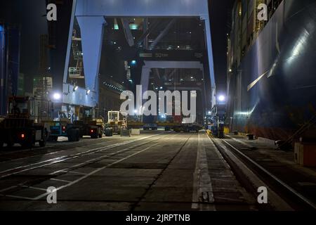 Odessa, Ukraine SIRCA 2019: Container ship at port terminal. Containers loading by crane in night , Trade Port. container operation in port series Stock Photo