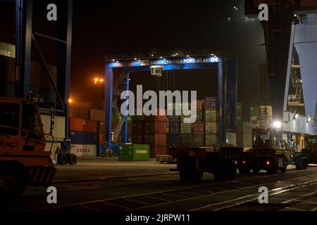 Odessa, Ukraine SIRCA 2019: Container ship at port terminal. Containers loading by crane in night , Trade Port. container operation in port series Stock Photo