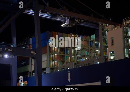 Odessa, Ukraine SIRCA 2019: Container ship at port terminal. Containers loading by crane in night , Trade Port. container operation in port series Stock Photo