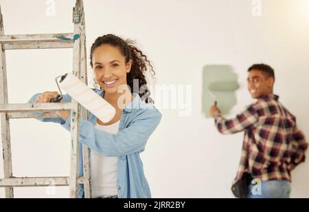 DIY, maintenance and painting couple for home renovation project, construction for interior design in apartment and smile for creative repair job Stock Photo