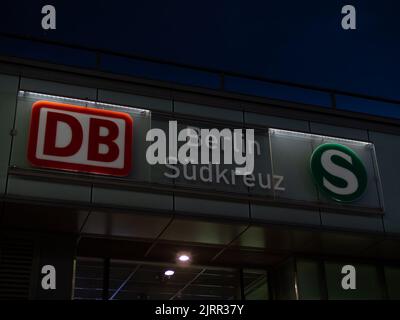 Berlin Südkreuz train station at night. Name of the station with a big DB logo of the Deutsche Bahn company. Public transportation in an urban area. Stock Photo