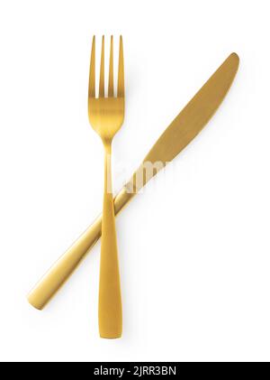 Golden knives and forks set against a white background. Gold cutlery. Beautiful gold cutlery. View from above. Stock Photo