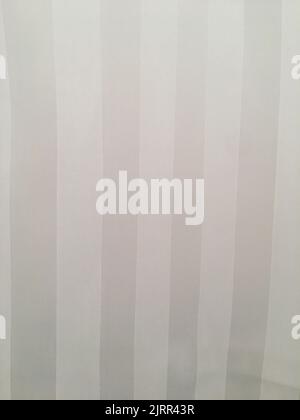 Vertical gray and white striped fabric textile background Stock Photo