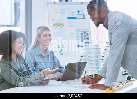 Architect teamwork, building engineer or designer on laptop talking, meeting or planning 3d model architecture design. Working developer or diversity Stock Photo