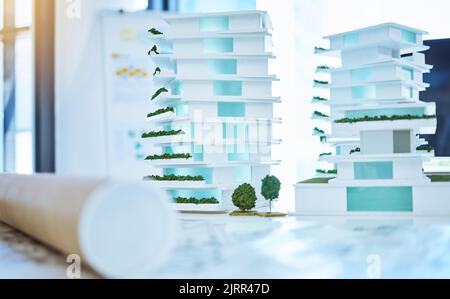 Architecture, design and 3D building of a creative plan for construction with blueprints on a table in an office. Business plans of architectural work Stock Photo
