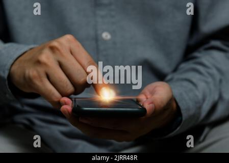 man using point finger on screen mobile smart phone.Business technology digital internet network concept. Stock Photo