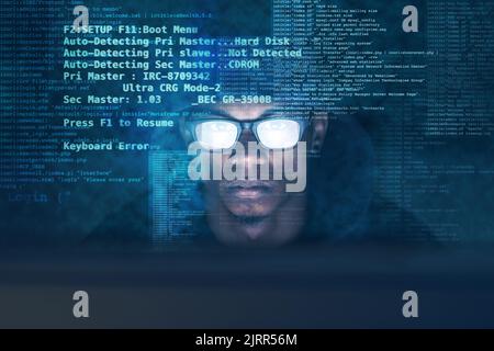 Not your average hacker. a young man hacking into a secure computer network. Stock Photo