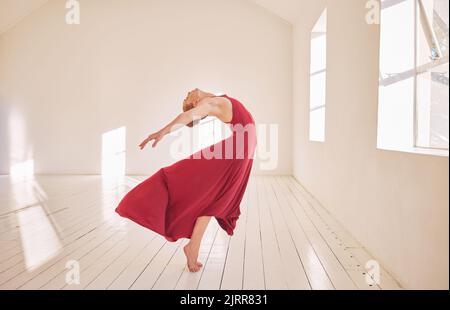 Freedom, energy and ballet or ballroom dancer training in dance studio, stretching and passionate dancing. Active performance from a flexible woman Stock Photo