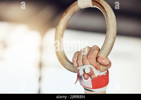 Gym, ring and sport gymnastic athlete training for muscle, balance and flexibility strength, in exercise fitness center. Motivation and health Stock Photo