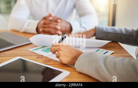 Business hands, teamwork and data writing on paper for kpi, company growth charts and graphs in office meeting. Zoom of man and woman with digital Stock Photo