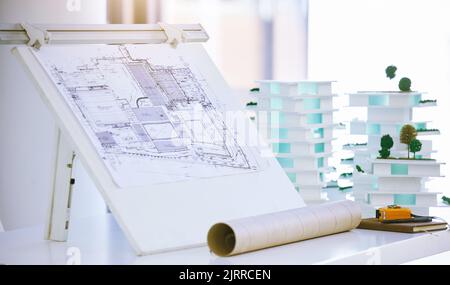 Blueprints, architecture and design of building model with plans for construction in architectural office. Creative engineering, vision and real Stock Photo
