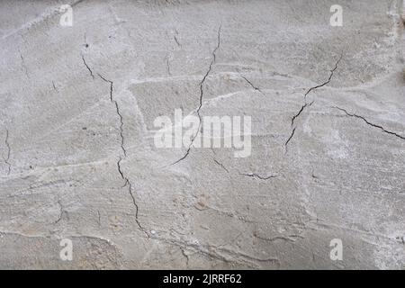 A concrete surface that has recently been built and cracks have appeared - Construction concept - textured concrete surface Stock Photo