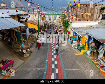 Beautiful aerial view of San Juan la Laguna small town in the Guatemala Atitlan lake - Umbrella Streets, colorful people and tourists Stock Photo