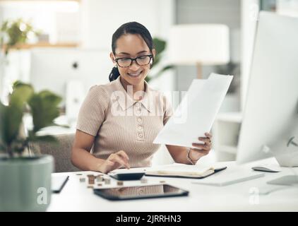 Finance intern, career or financial employee learning her banking budgeting on a calculator. Young accountant, money insurance advisor or investment Stock Photo