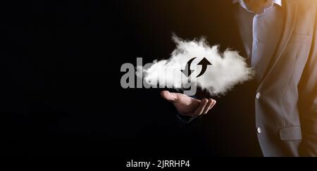 Cloud technology. Polygonal wireframe cloud storage sign with two arrows up and down on dark . Cloud computing, big data center, future infrastructure Stock Photo