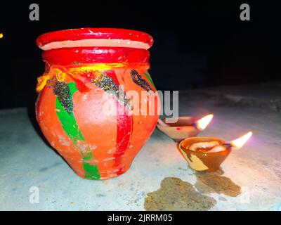 Traditional clay diya lamps lit during diwali celebration Stock Photo