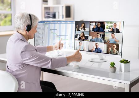 Young Happy Business Woman In Video Conferencing Call Stock Photo