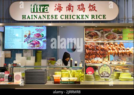 A halal certified stall serving Chinese Hainanese chicken rice and Chinese noodle dishes in a modern foodcourt, Singapore Stock Photo