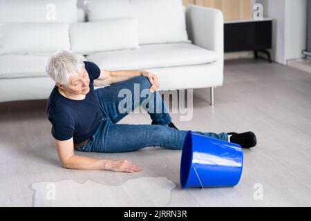 Slip And Fall Accident. Wet Floor Water Spill Stock Photo